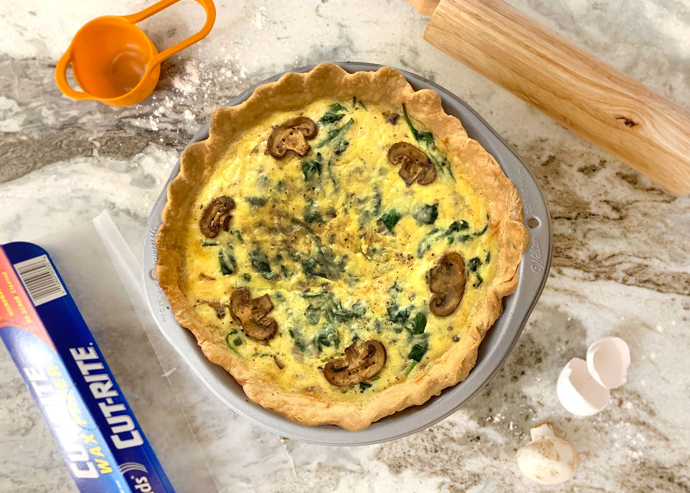 A deliciously flavorful and easy quiche for breakfast or brunch. The garlic, mushrooms, and spinach are perfectly complemented by the light and tangy gruyere/swiss blend added in. This quiche has the perfect texture, a satisfyingly light and crisp crust, and a taste you'll crave over and over again!