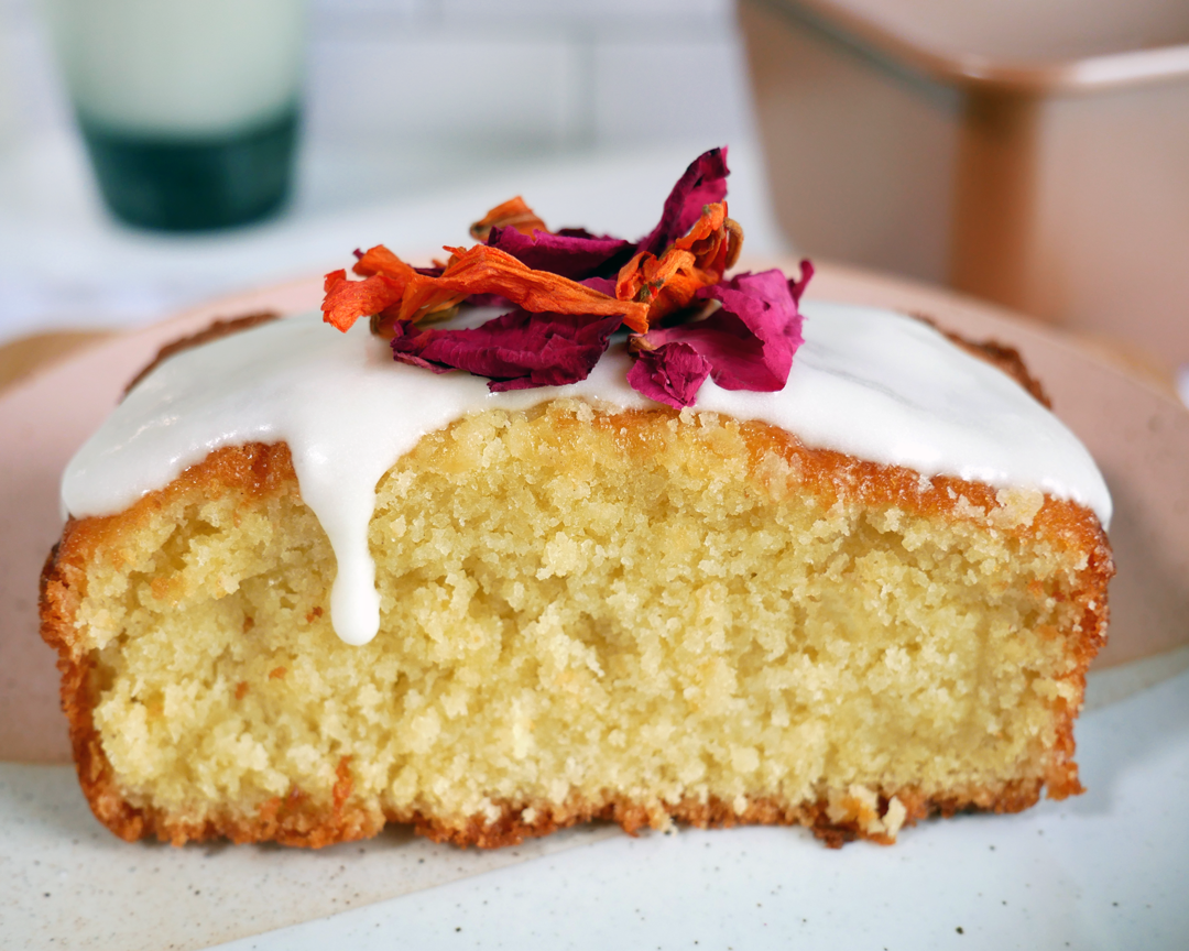 Glazed pound cake with edible flowers on top - featuring lemon glaze, classic vanilla glaze, rose glaze
