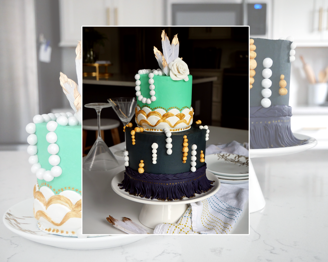 Roaring '20s cake, Great Gatsby themed cake, two tier blue and gold cake with scalloped edges, pearls, fringe, and gold with a fondant flower.