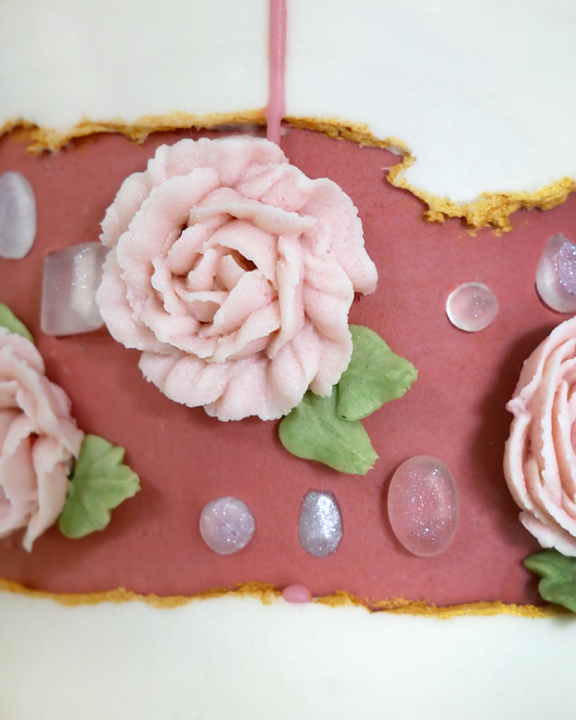 diamond buttercream rose fault line cake with isomalt diamonds and piped buttercream flowers