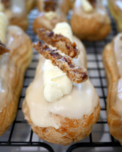 candied caramel pecans on maple glazed creme brulee eclairs